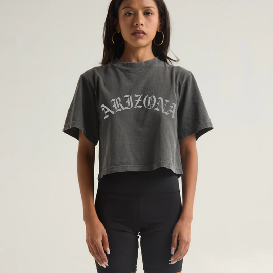 Woman wearing a gray 'Arizona' t-shirt against a plain background