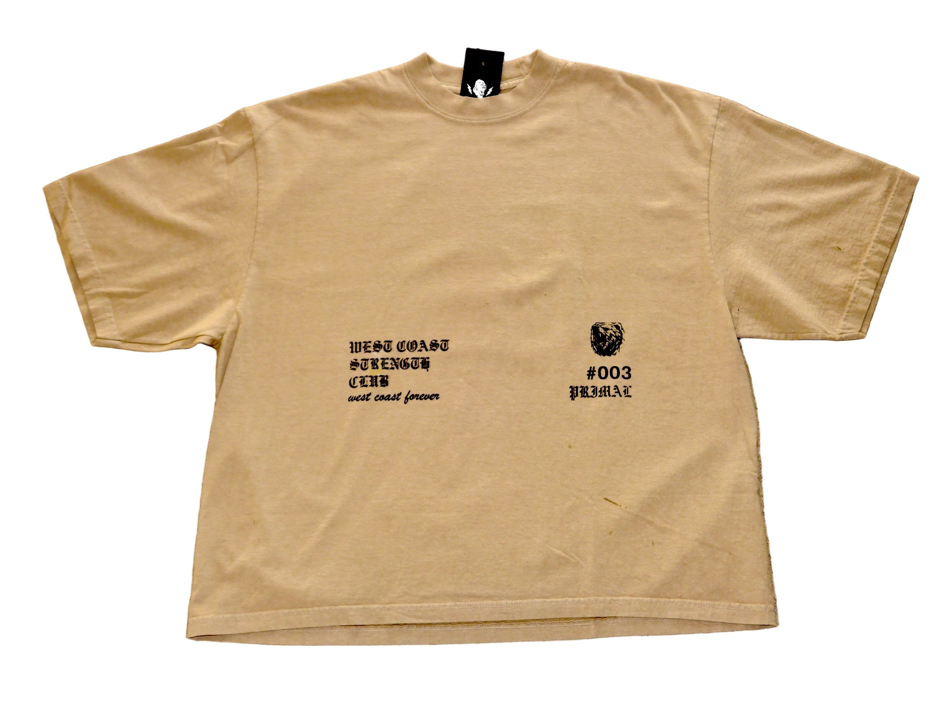 Beige t-shirt with black text and graphics on a textured beige surface