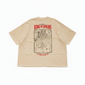 Beige t-shirt with graphic design and text on a textured surface